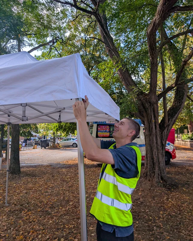 Henry fitting the canopy to one of our gazebos at a village event